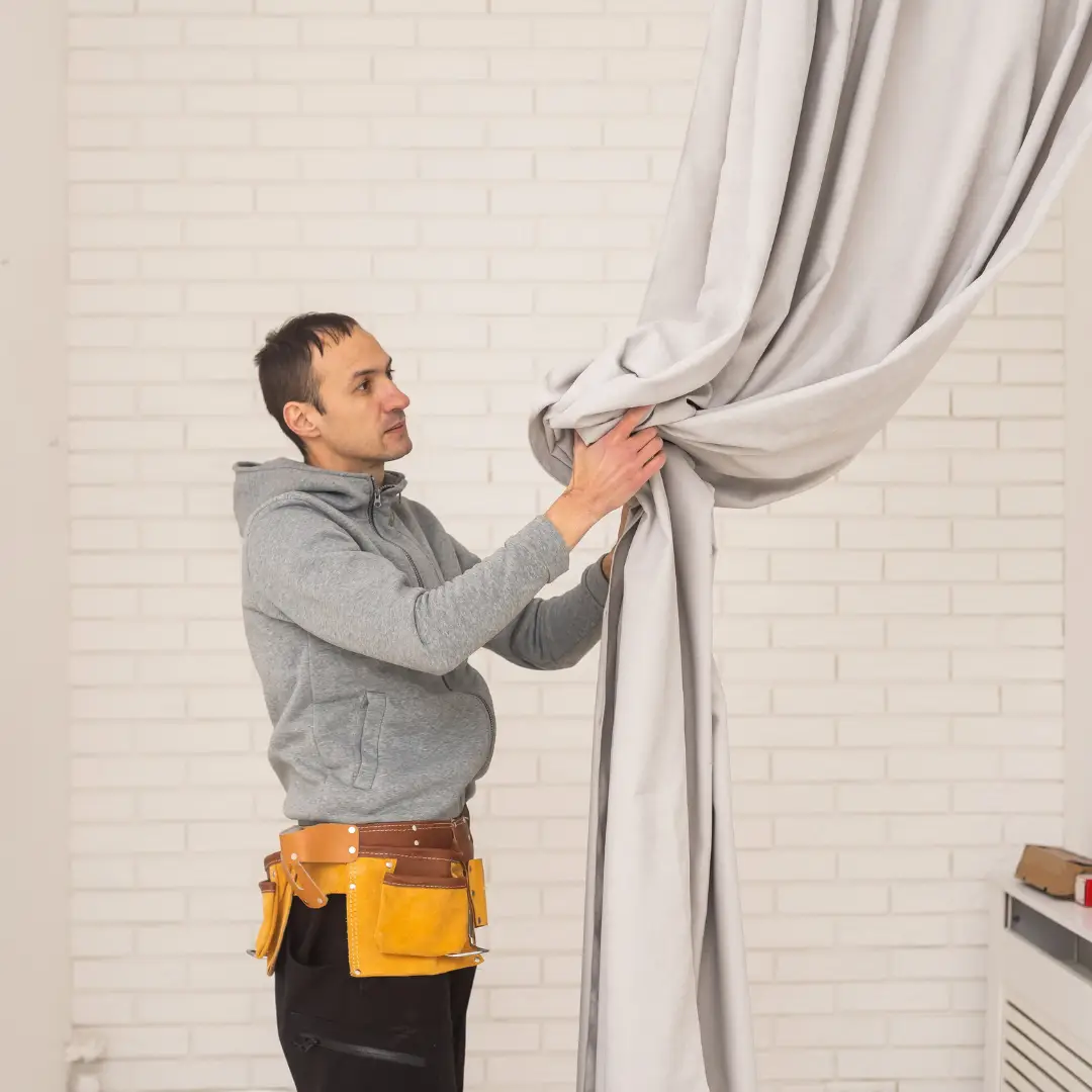 Professional curtain repair technician working in Abu Dhabi